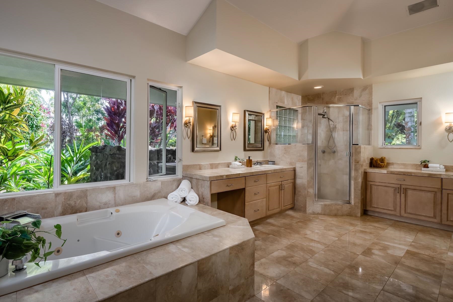 110 Mehana Road Haiku, HI 96708 - Photo 20 of 30 a spacious bathroom with a tub sink and mirror