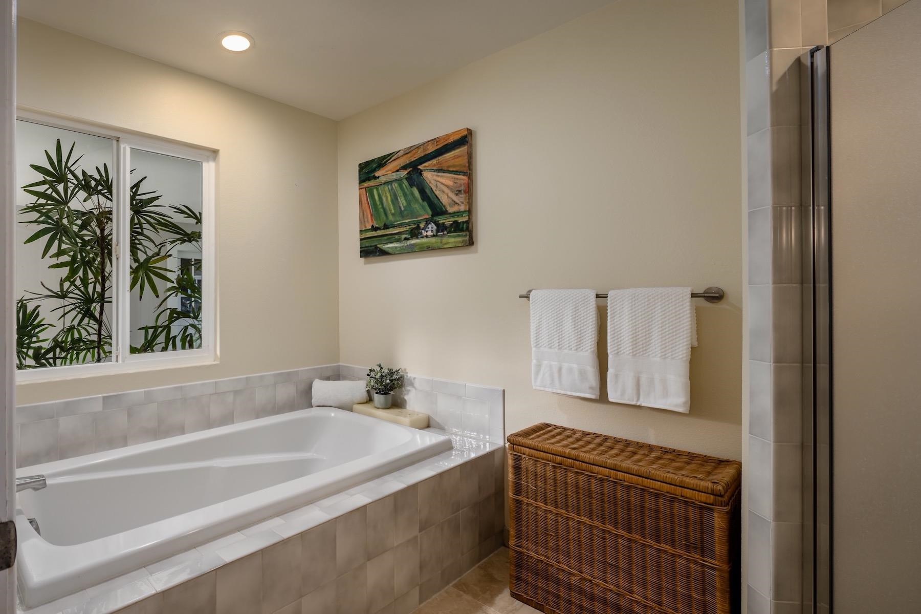 110 Mehana Road Haiku, HI 96708 - Photo 23 of 30 a bathroom with a bathtub and a shower