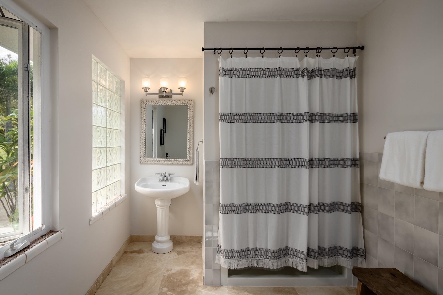 110 Mehana Road Haiku, HI 96708 - Photo 26 of 30 a bathroom with a toilet a sink and shower