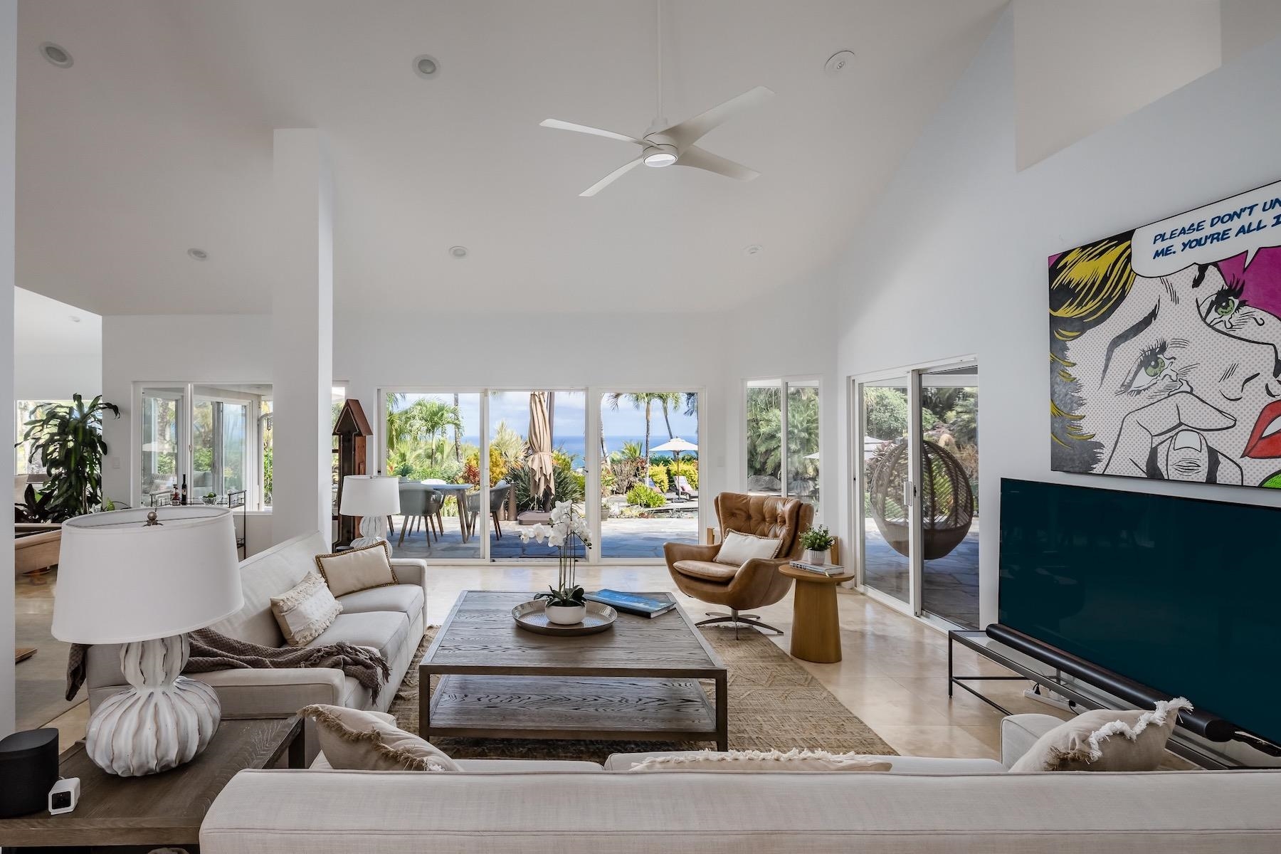 110 Mehana Road Haiku, HI 96708 - Photo 5 of 30 a living room with furniture fireplace and flat screen tv