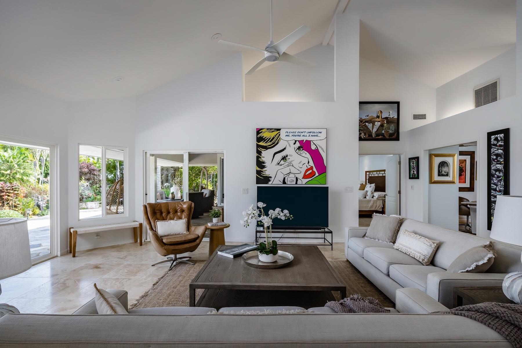 110 Mehana Road Haiku, HI 96708 - Photo 6 of 30 a living room with furniture and a flat screen tv