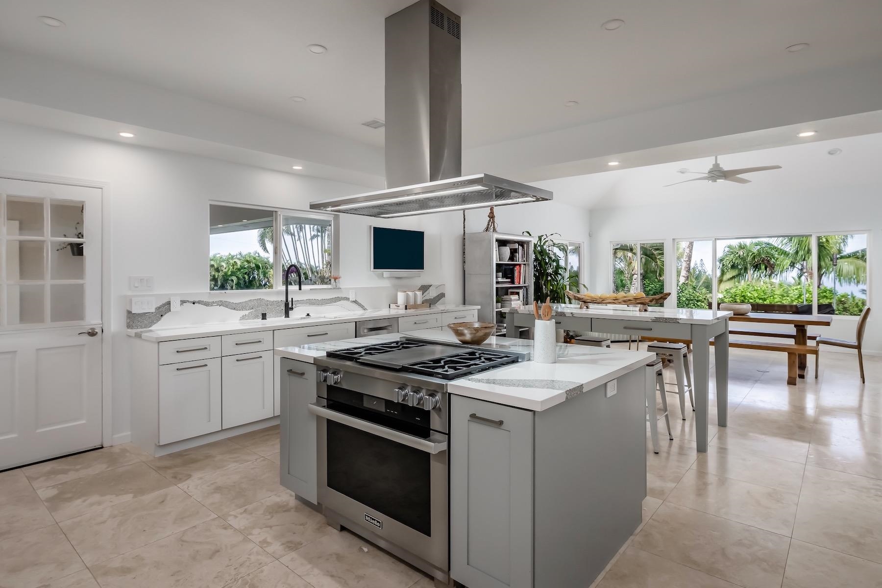 110 Mehana Road Haiku, HI 96708 - Photo 10 of 30 a kitchen with a sink stove and cabinets
