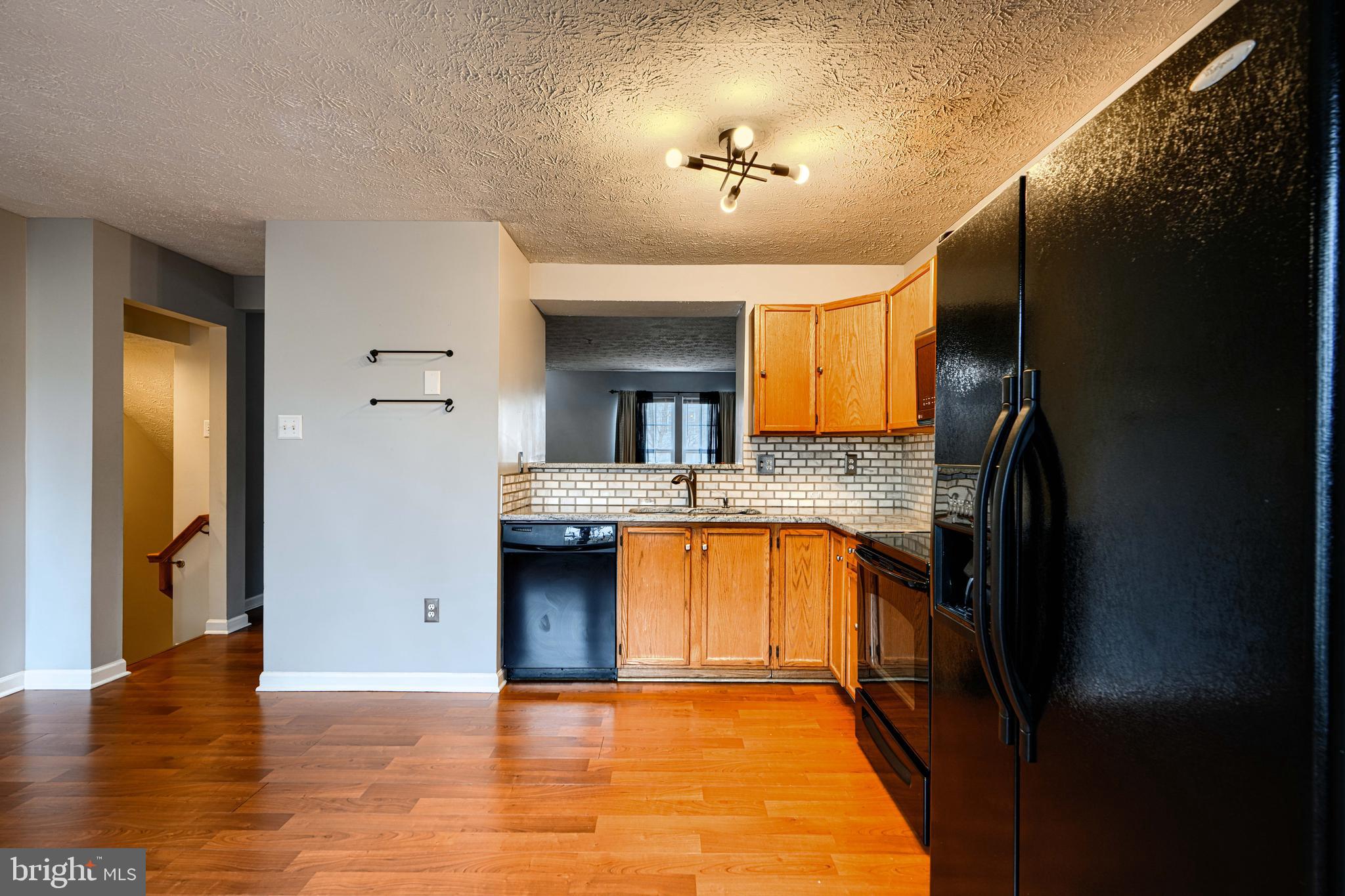 62 Gwynnswood Road Owings Mills, MD 21117 - Photo 11 of 44 a kitchen with stainless steel appliances granite countertop a refrigerator and a sink