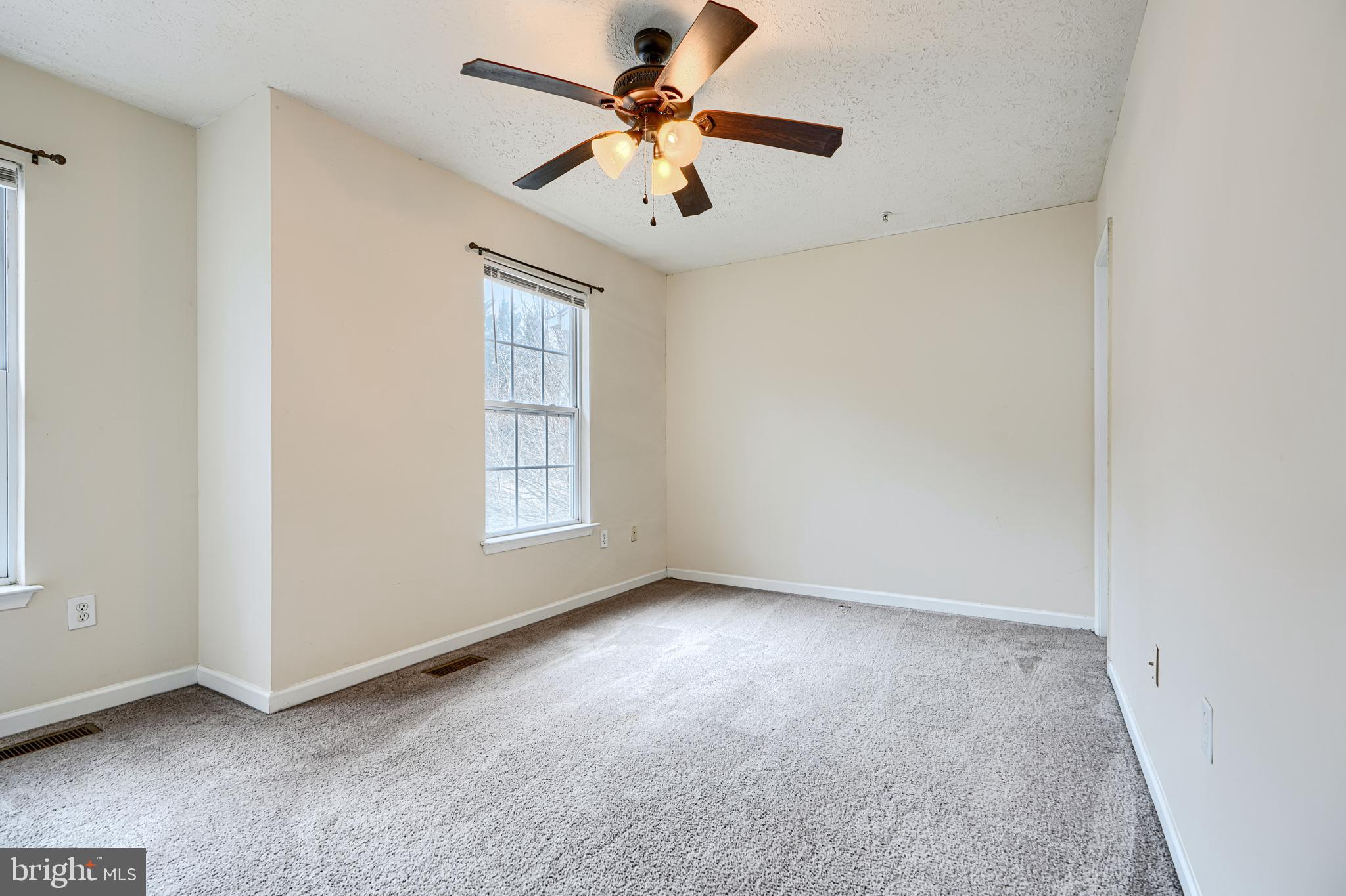 62 Gwynnswood Road Owings Mills, MD 21117 - Photo 19 of 44 an empty room with windows and fan