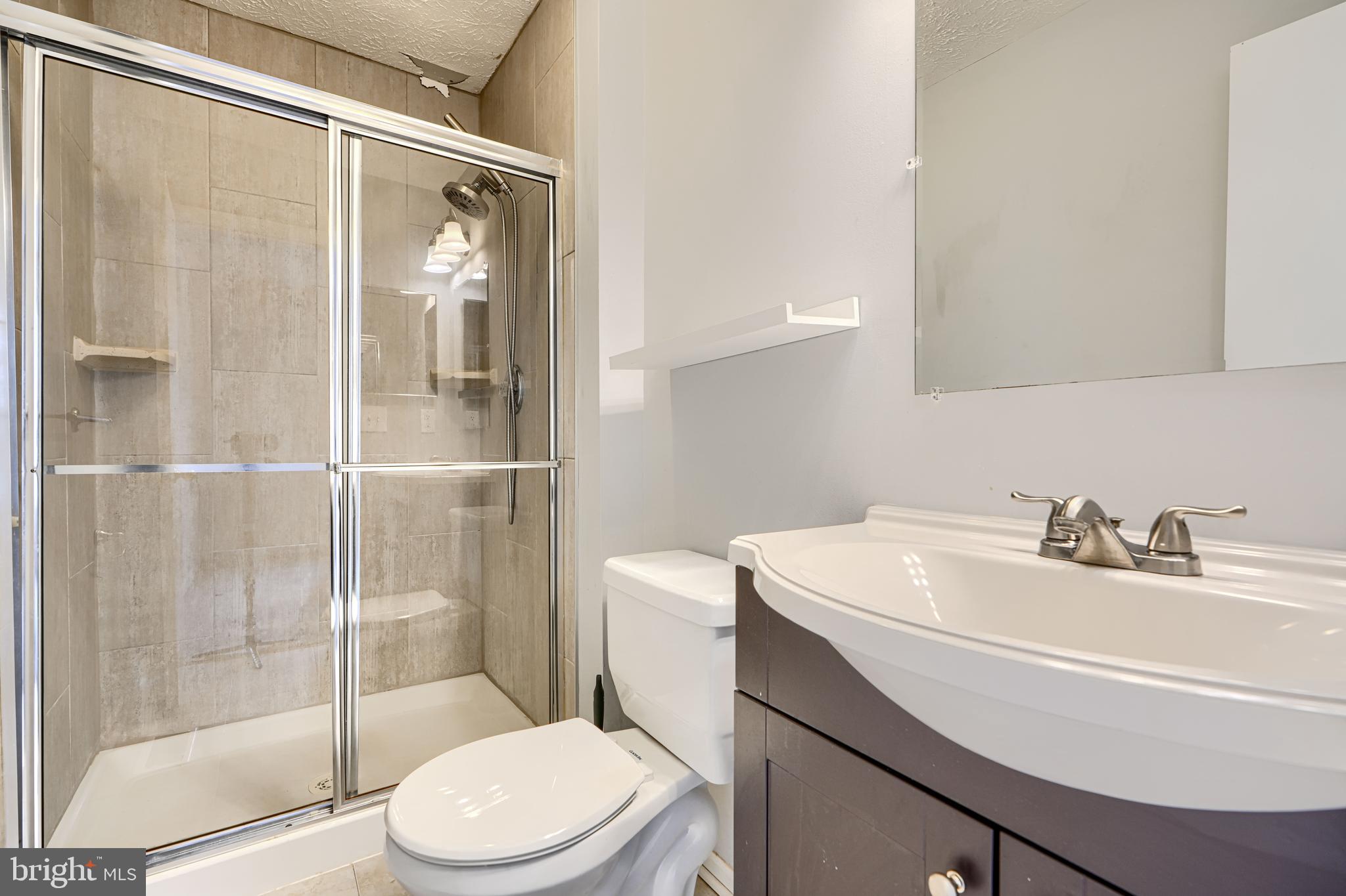 62 Gwynnswood Road Owings Mills, MD 21117 - Photo 23 of 44 a bathroom with a sink toilet and shower