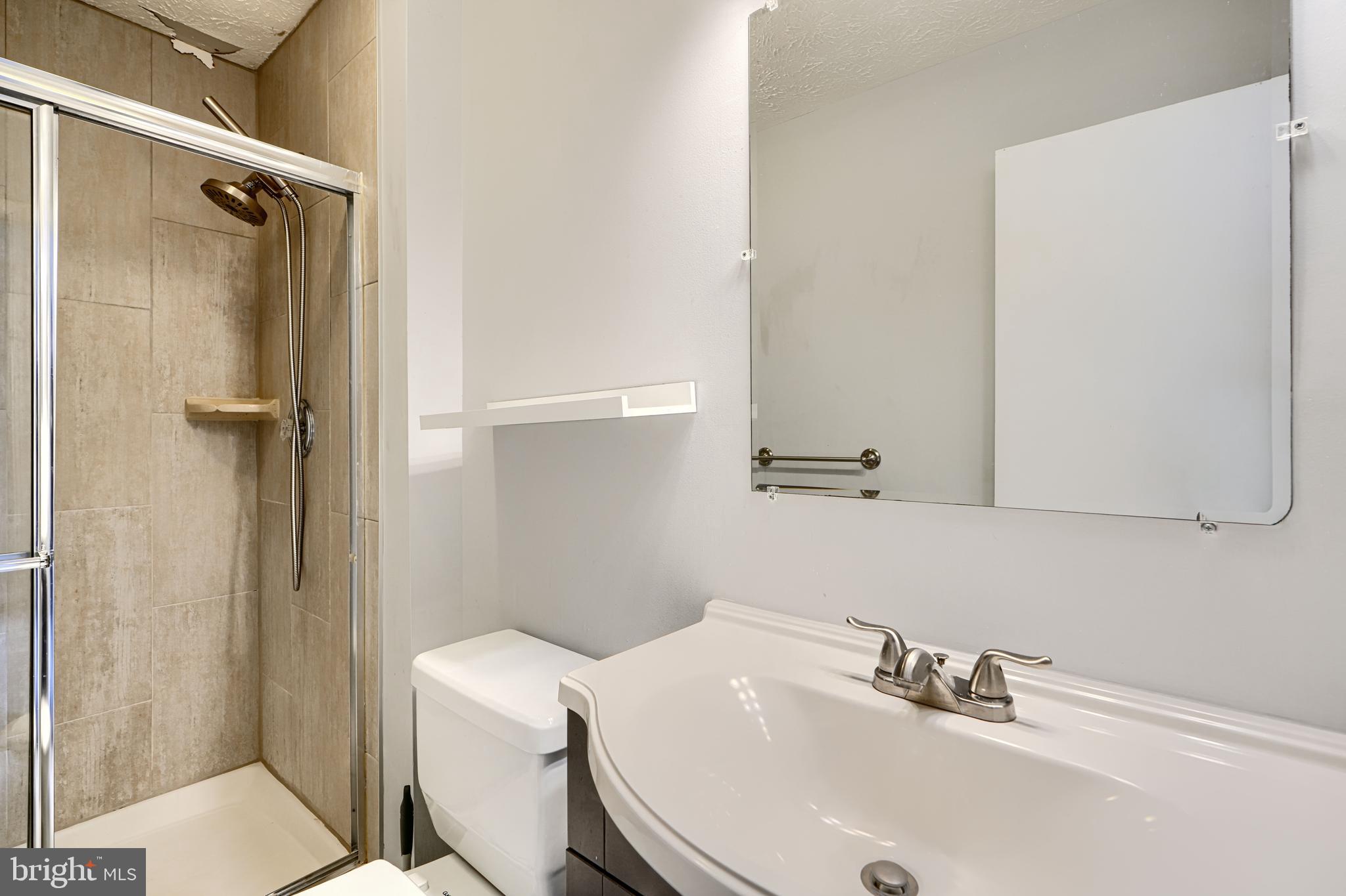 62 Gwynnswood Road Owings Mills, MD 21117 - Photo 26 of 44 a bathroom with a sink a toilet and shower