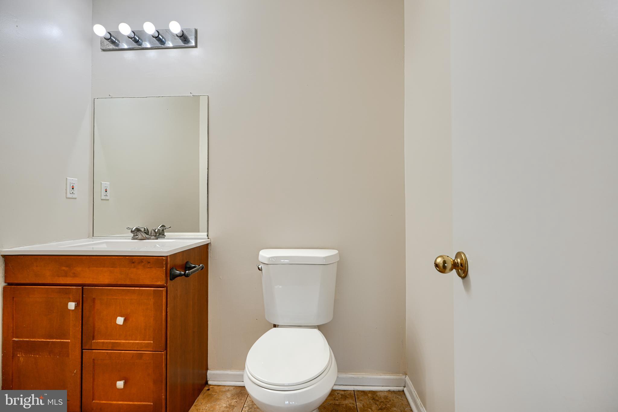 62 Gwynnswood Road Owings Mills, MD 21117 - Photo 31 of 44 a bathroom with a toilet a sink and mirror