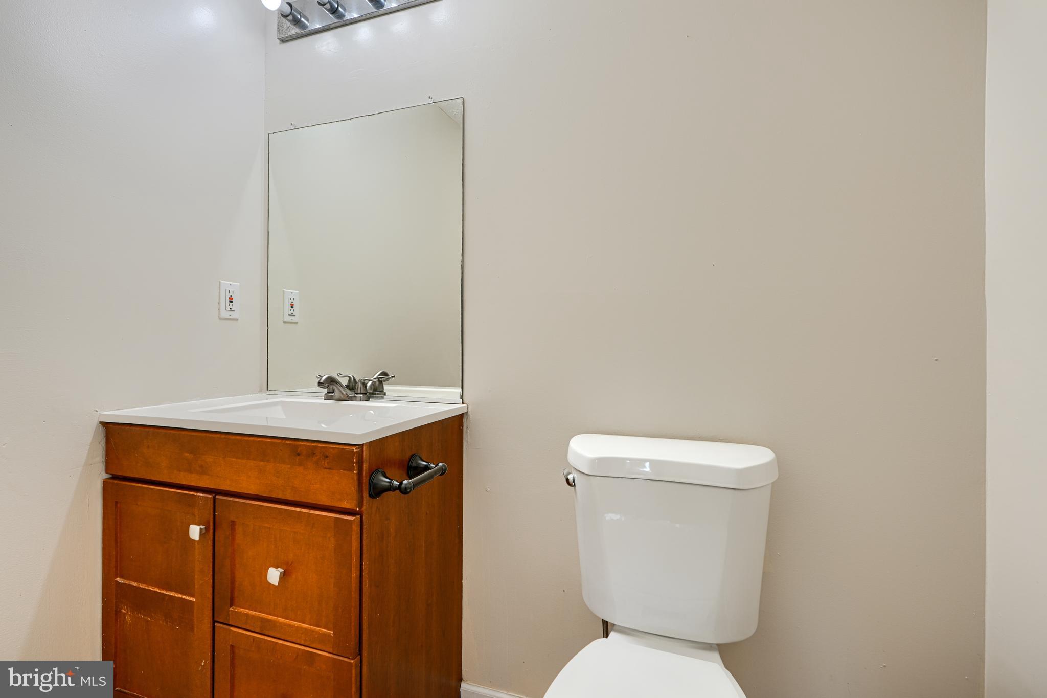 62 Gwynnswood Road Owings Mills, MD 21117 - Photo 32 of 44 a bathroom with a sink a toilet and mirror
