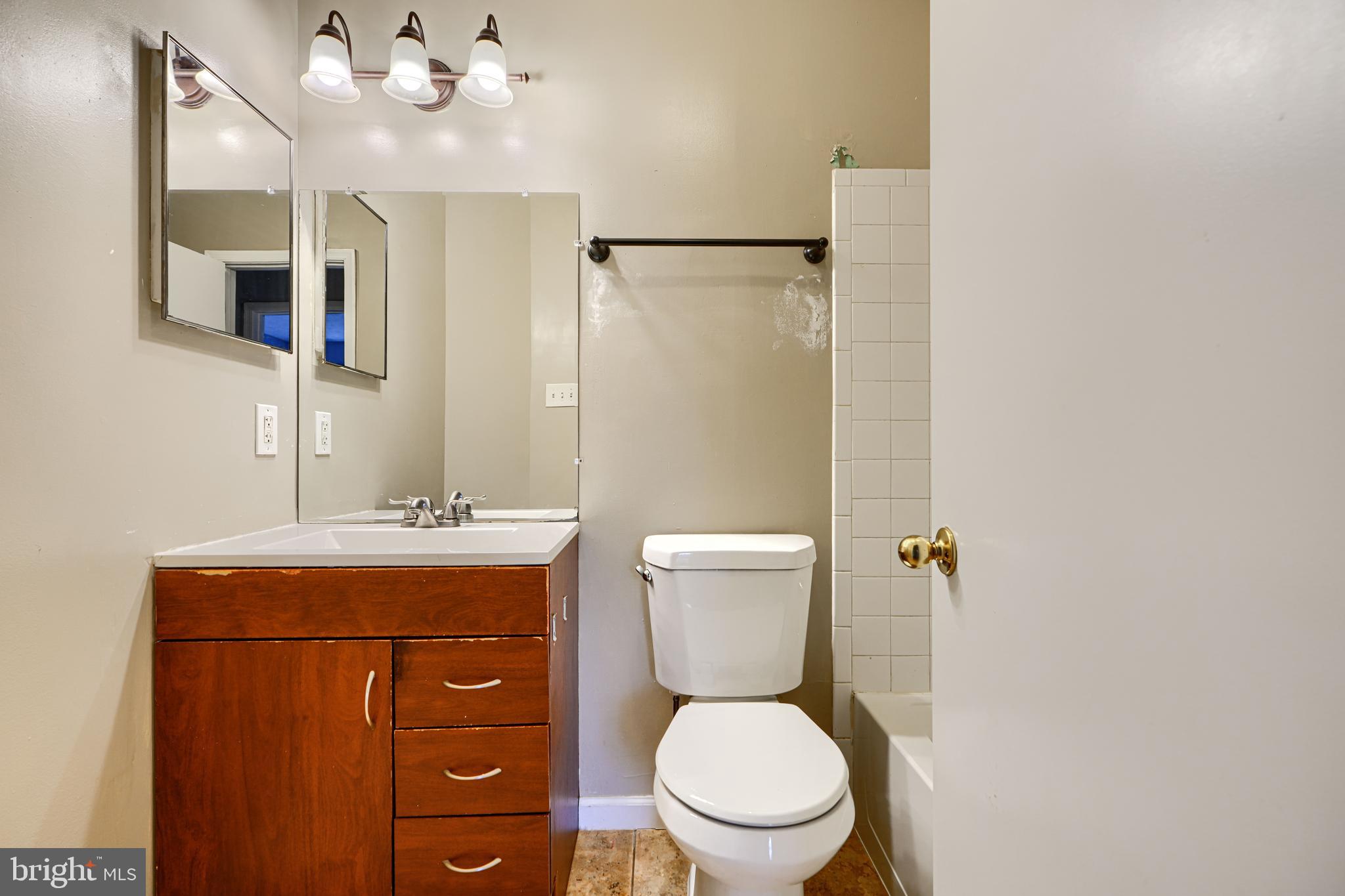 62 Gwynnswood Road Owings Mills, MD 21117 - Photo 33 of 44 a bathroom with a toilet a sink and mirror