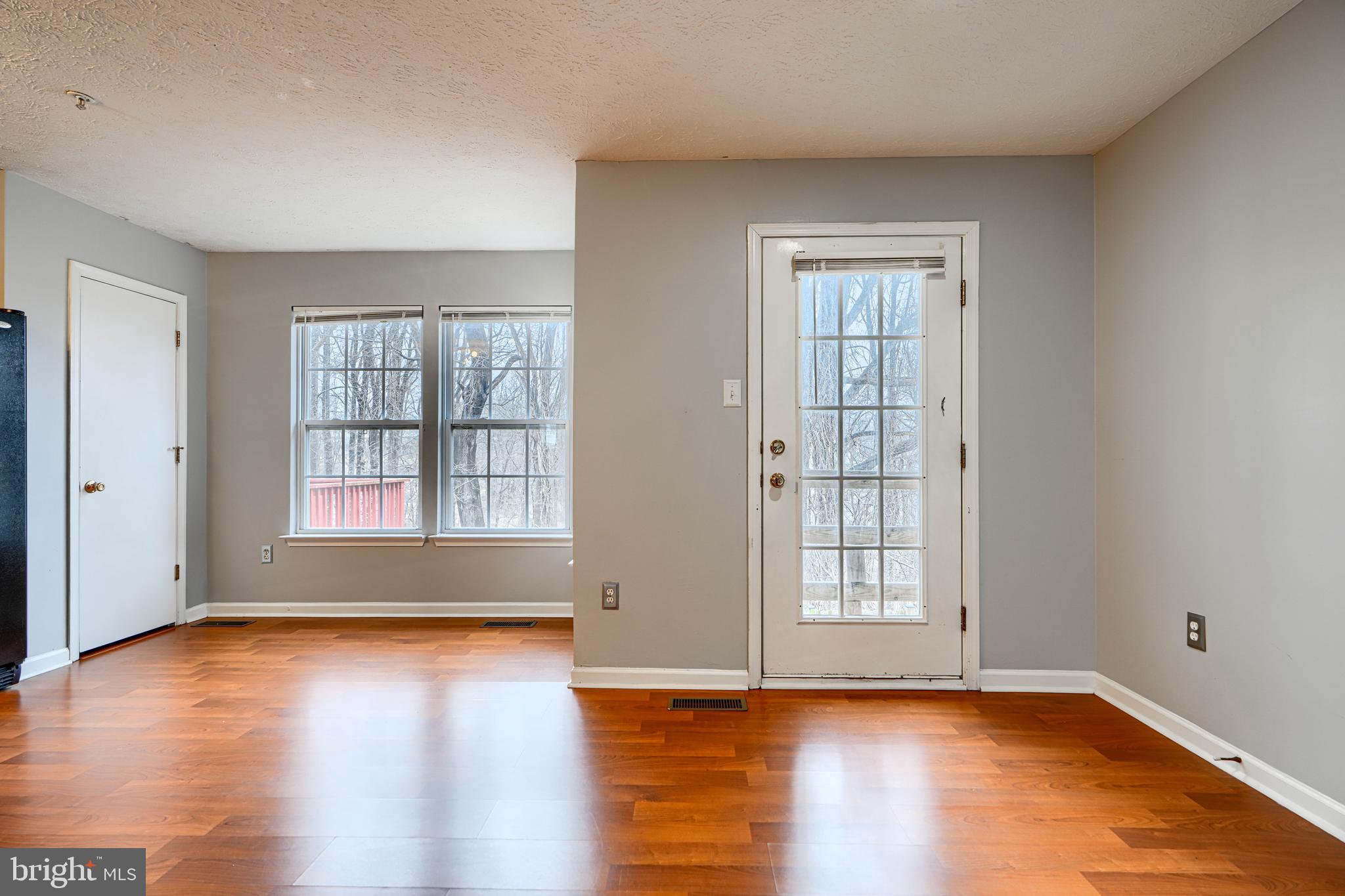 62 Gwynnswood Road Owings Mills, MD 21117 - Photo 5 of 44 a view of an empty room with wooden floor and a window
