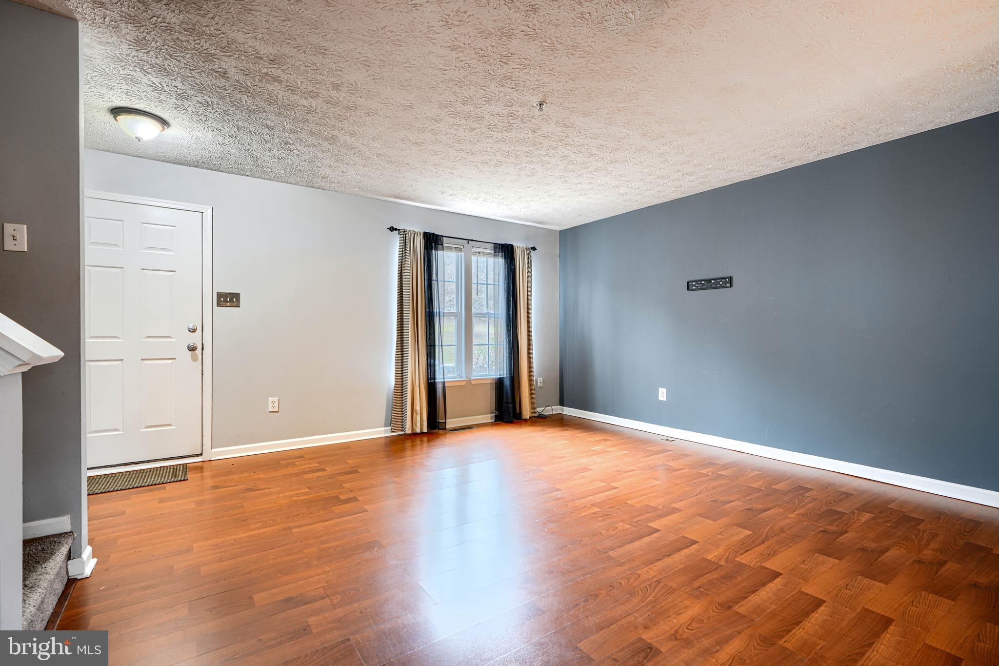 62 Gwynnswood Road Owings Mills, MD 21117 - Photo 9 of 44 a view of an empty room with wooden floor