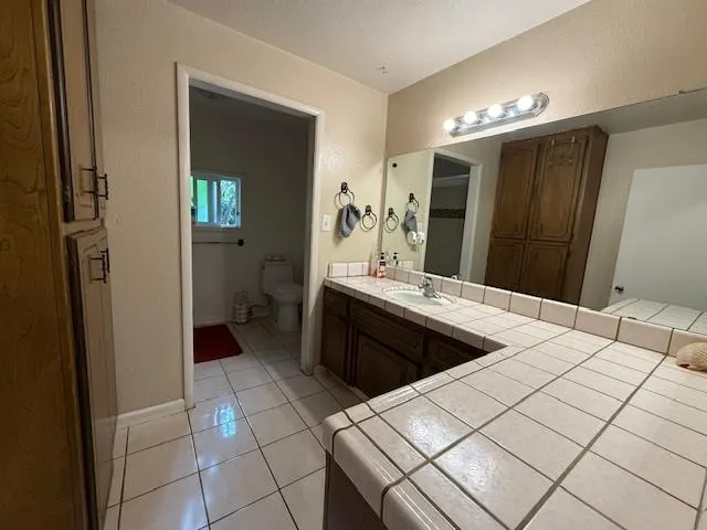 a kitchen with a sink and a refrigerator