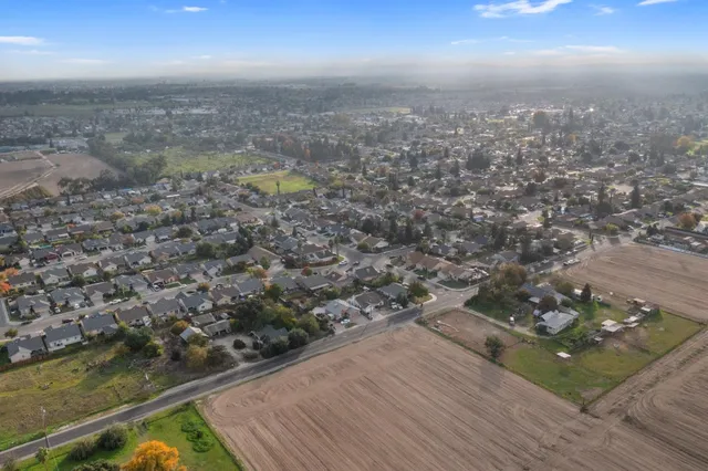 an aerial view of beach and city