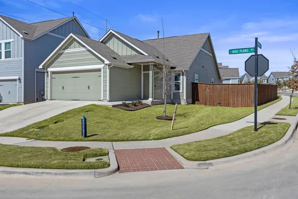 a front view of a house with garage