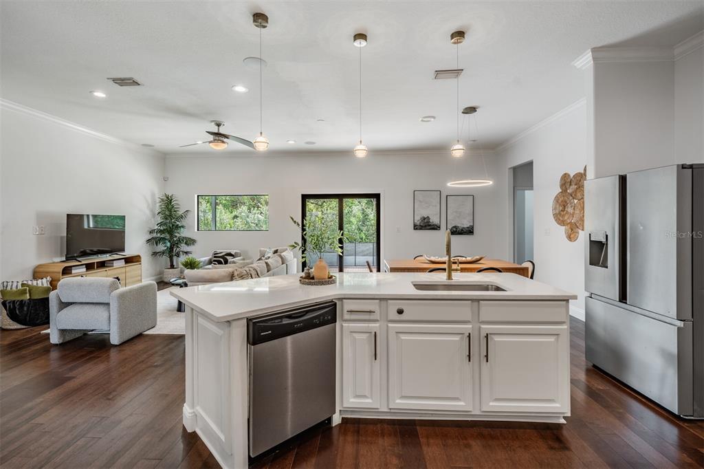 4003 South Shamrock Road Tampa, FL 33611 - Photo 16 of 38 a kitchen with a sink stove and refrigerator