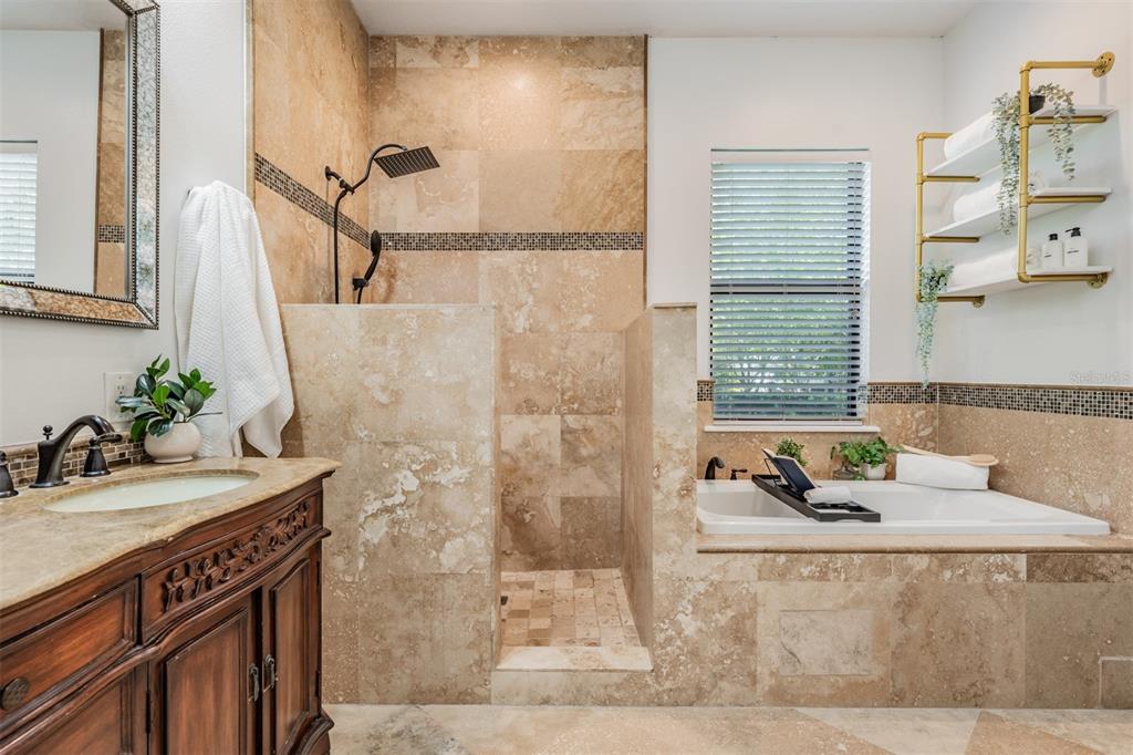 4003 South Shamrock Road Tampa, FL 33611 - Photo 23 of 38 a bathroom with a sink and a mirror