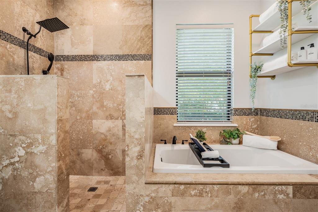 4003 South Shamrock Road Tampa, FL 33611 - Photo 24 of 38 a bathroom with a bathtub and a shower