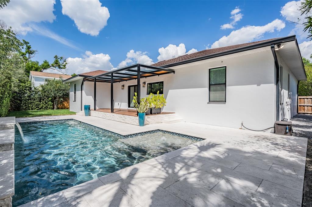 4003 South Shamrock Road Tampa, FL 33611 - Photo 34 of 38 a view of a house with a yard