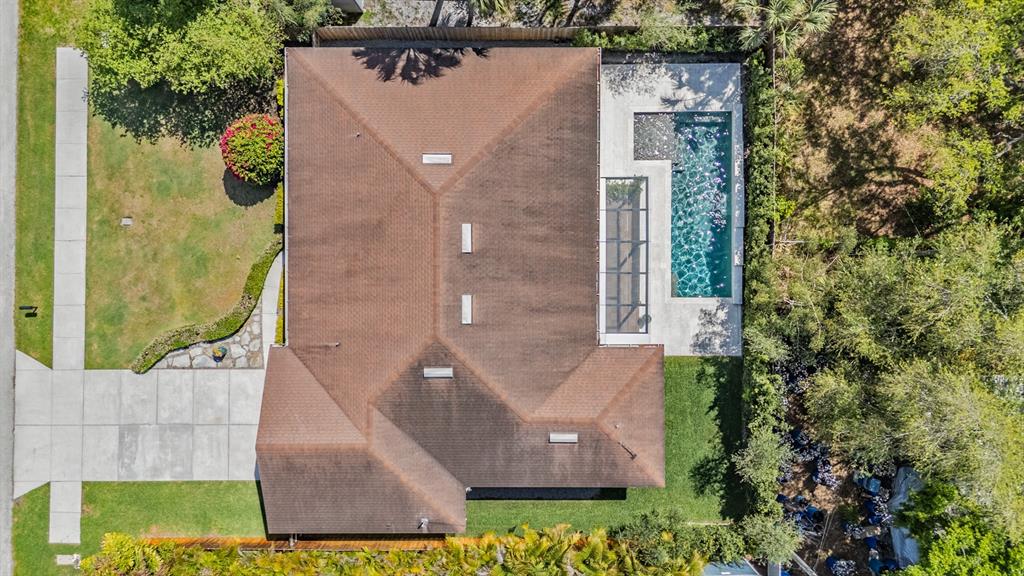 4003 South Shamrock Road Tampa, FL 33611 - Photo 36 of 38 aerial view of a house with a yard and potted plants