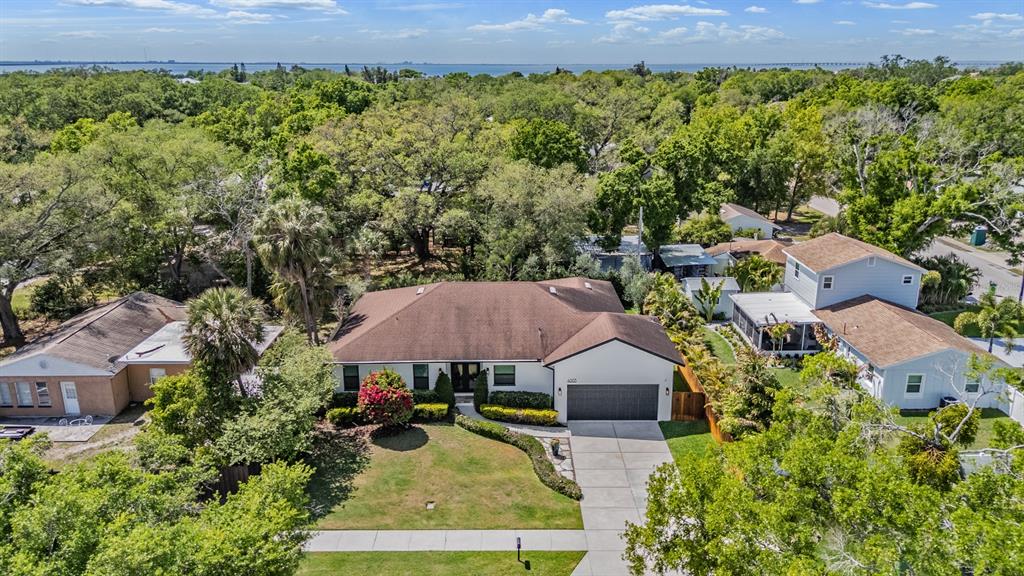 4003 South Shamrock Road Tampa, FL 33611 - Photo 37 of 38 an aerial view of a house with yard and mountain view in back