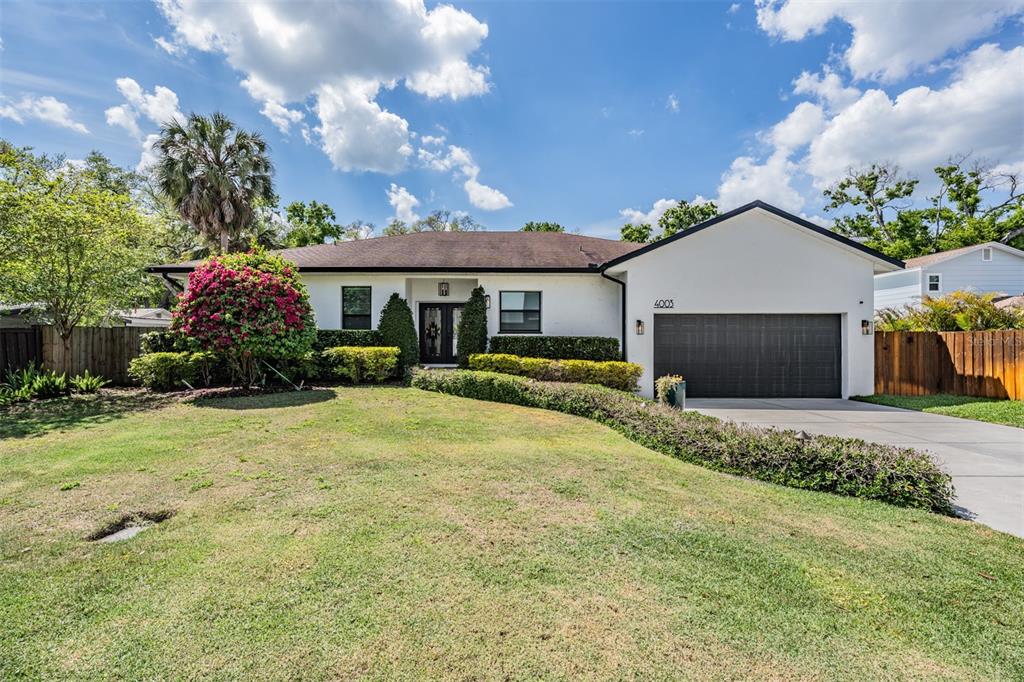 4003 South Shamrock Road Tampa, FL 33611 - Photo 38 of 38 a front view of a house with garden