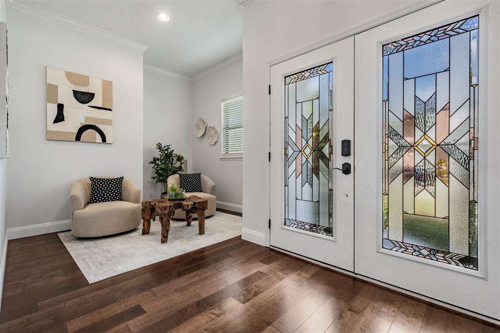 4003 South Shamrock Road Tampa, FL 33611 - Photo 5 of 38 a living room with furniture and a floor to ceiling window