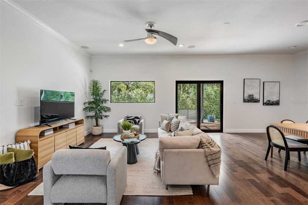 4003 South Shamrock Road Tampa, FL 33611 - Photo 8 of 38 a living room with furniture and a flat screen tv