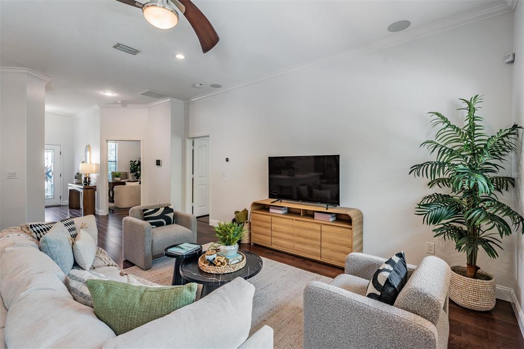 4003 South Shamrock Road Tampa, FL 33611 - Photo 9 of 38 a living room with furniture and a flat screen tv