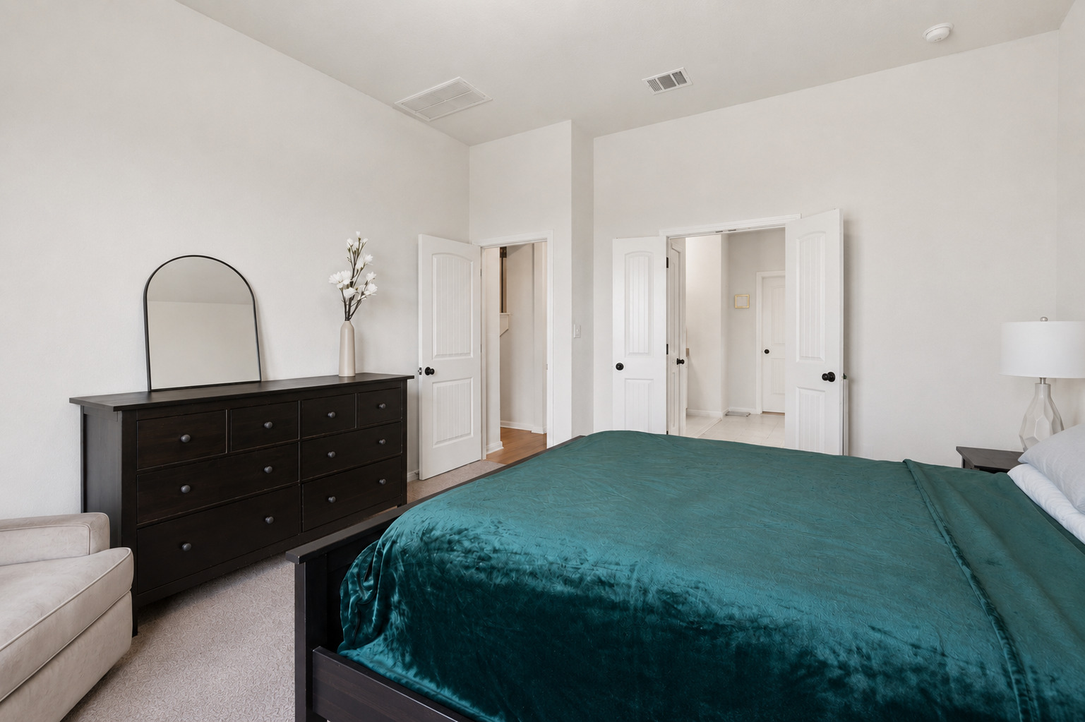 100 Panico Road Hutto, TX 78634 - Photo 16 of 28 Step into this serene, naturally illuminated bedroom, offering a peaceful retreat with plush carpeting and pristine walls.
