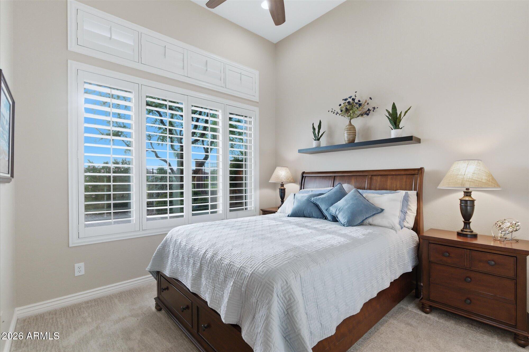 40322 North Hawk Ridge Trail Anthem, AZ 85086 - Photo 39 of 63 a bedroom with a bed and a window