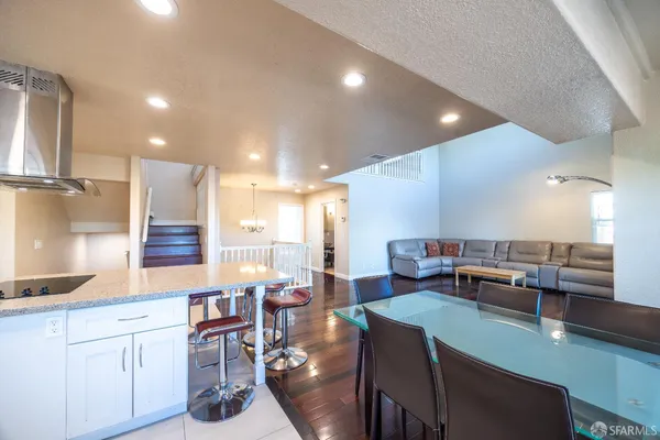 a large kitchen with a table and chairs