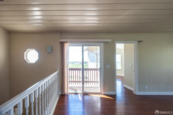 a view of entryway with wooden floor