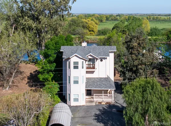 a aerial view of a house with a yard