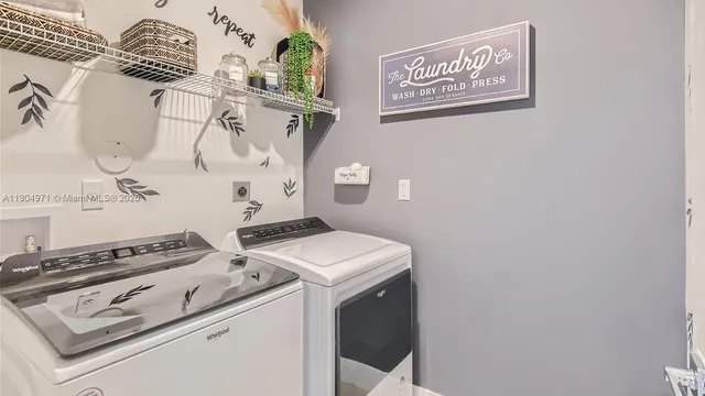 a utility room with dryer and washer