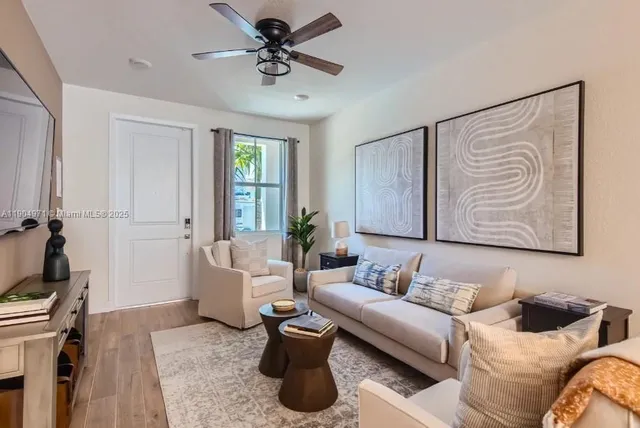 a living room with furniture and a window