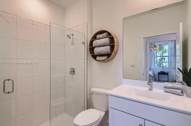 a bathroom with a sink toilet and shower