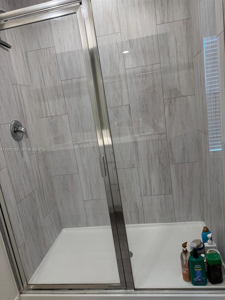 3902 Southwest Brunswick Street Port St. Lucie, FL 34953 - Photo 19 of 23 a bathroom with a shower