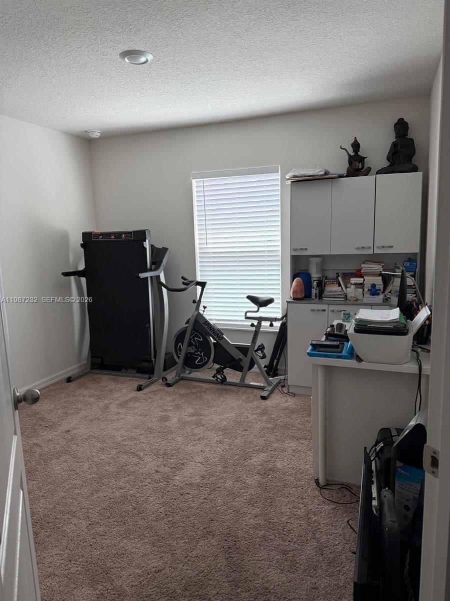 3902 Southwest Brunswick Street Port St. Lucie, FL 34953 - Photo 21 of 23 a view of a workspace with furniture