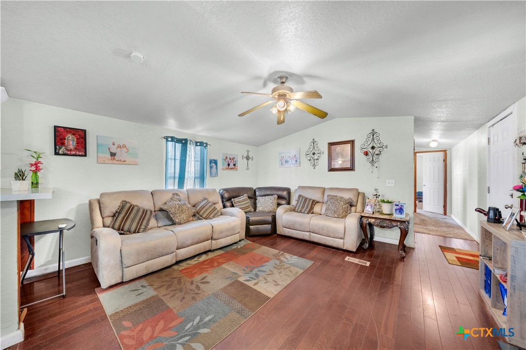 11791 Kinney Road Atascosa, TX 78002 - Photo 11 of 20 a living room with furniture and wooden floor