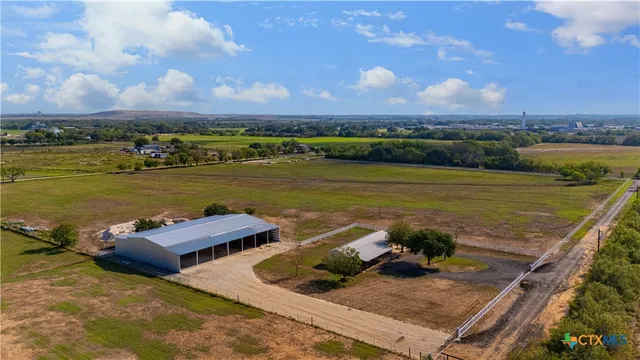 an aerial view of a house with a ocean view