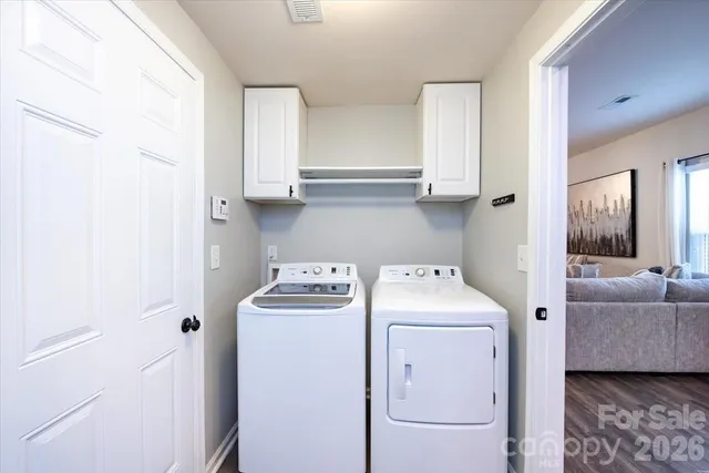 a view of bathroom with washer and dryer