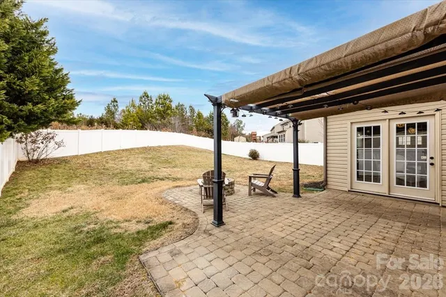 a view of a backyard of the house