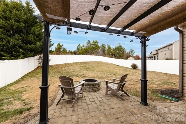 a view of a swimming pool with a lounge chair