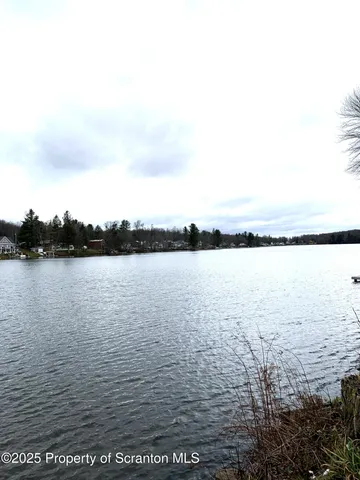 a kitchen with a refrigerator and a stove
