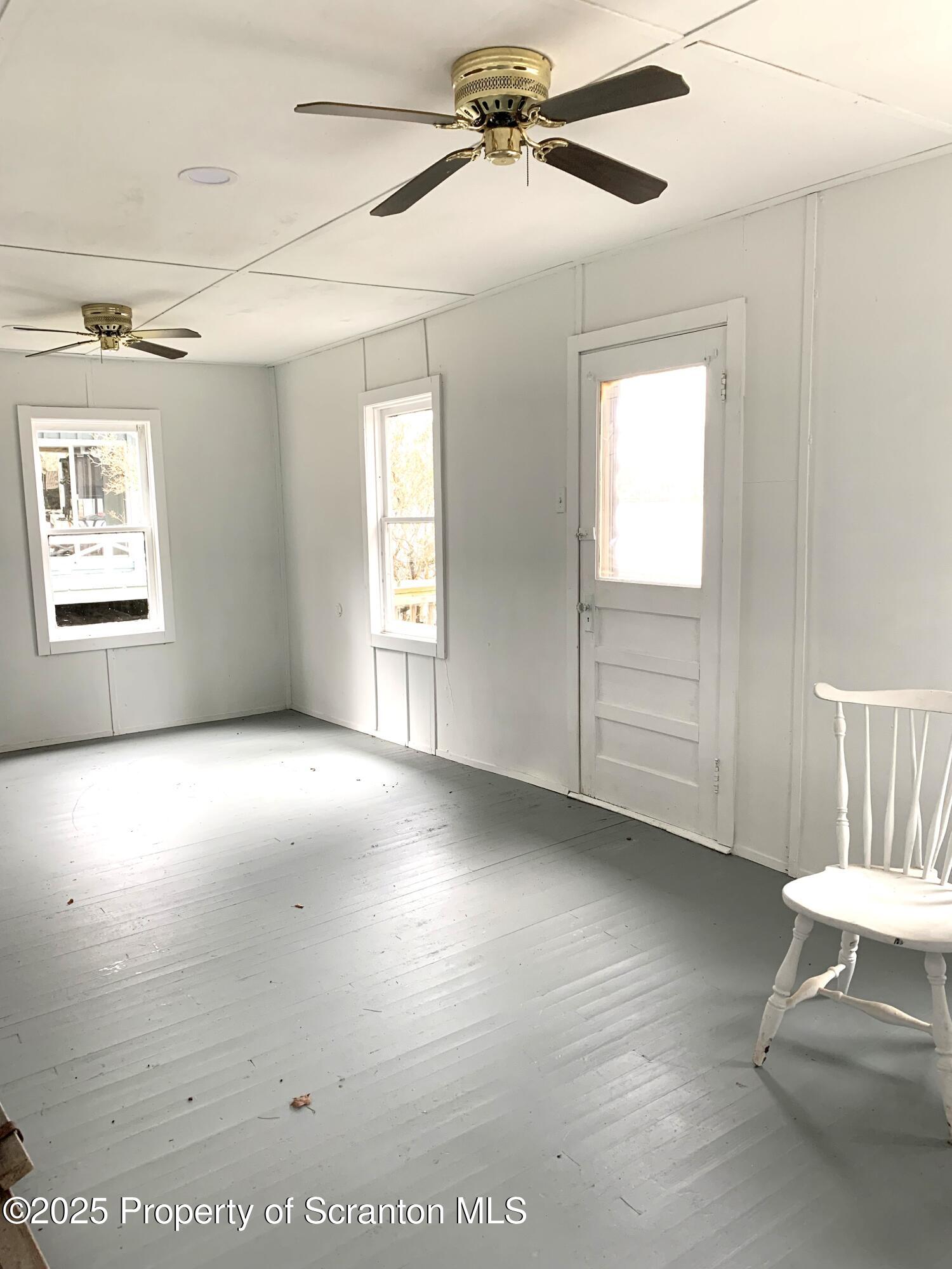 335 South Shore Drive Thompson, PA 18465 - Photo 9 of 15 a view of an empty room with a window