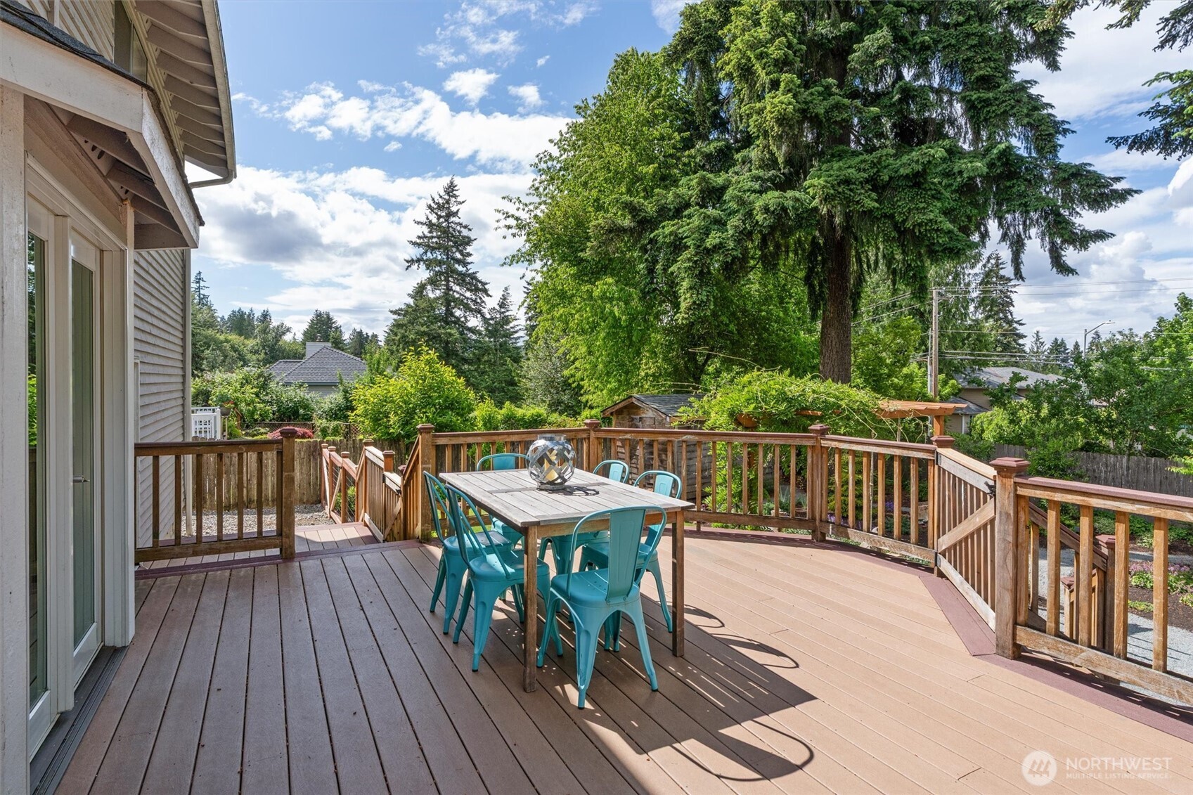 2101 233rd Street Southeast Bothell, WA 98021 - Photo 26 of 40 a view of a deck with furniture and trees