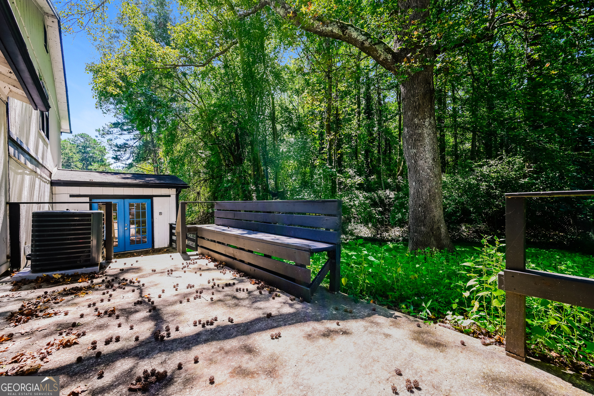 4301 Dogwood Farms Drive Decatur, GA 30034 - Photo 18 of 22 a wooden bench sitting in backyard of house