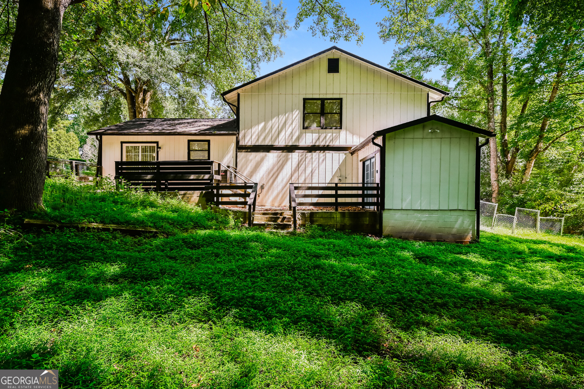 4301 Dogwood Farms Drive Decatur, GA 30034 - Photo 20 of 22 a view of a back yard of the house with a car park front of house