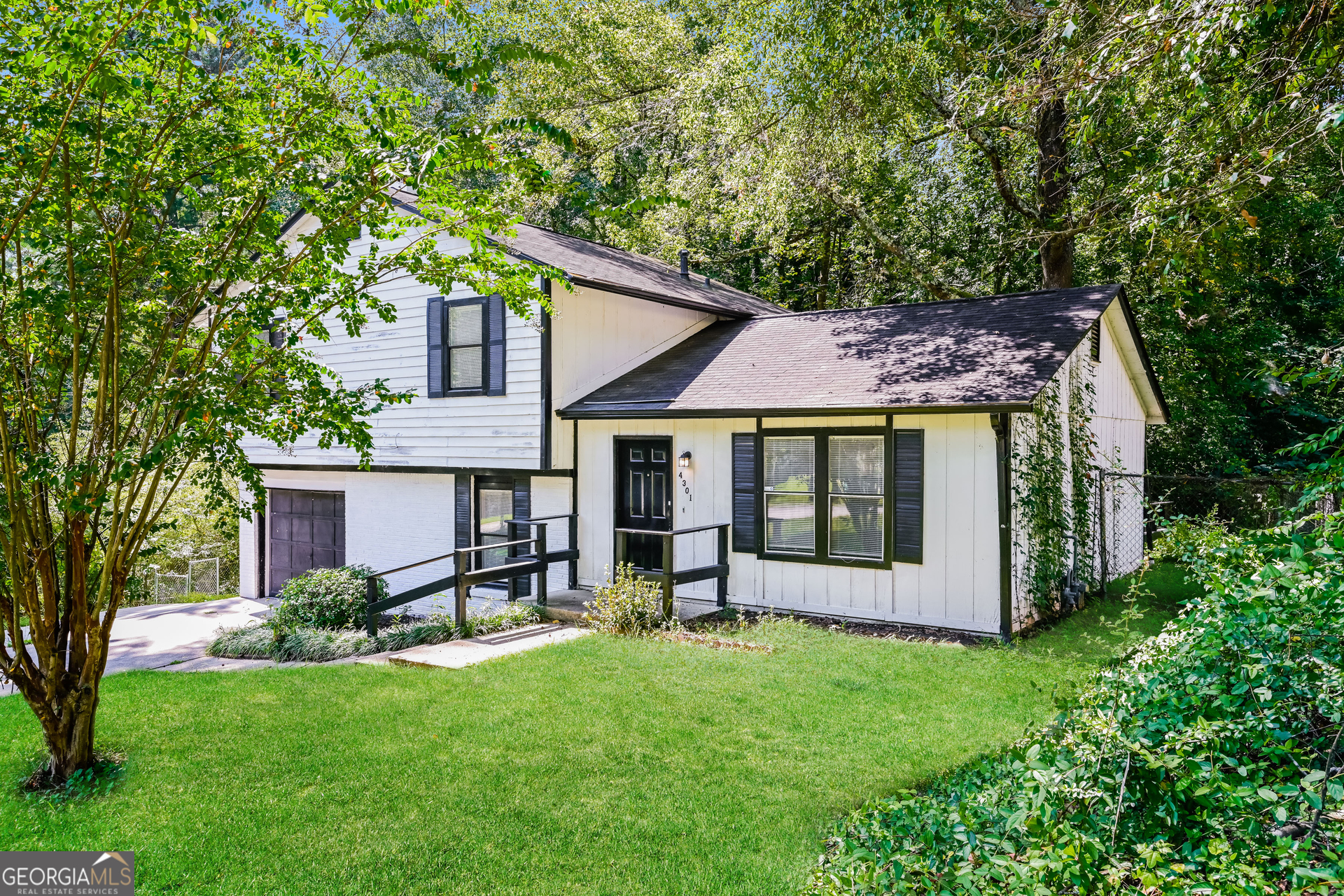 4301 Dogwood Farms Drive Decatur, GA 30034 - Photo 3 of 22 a view of a house with a yard plants and large tree