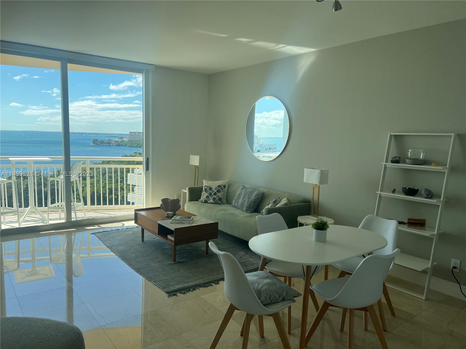 2475 Brickell Avenue, Unit 1509 Miami, FL 33129 - Photo 6 of 18 a living room with furniture and a large window